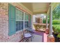 Cozy front porch with seating area, providing a welcoming entrance to the home at 3370 Battlement Cir, Loganville, GA 30052