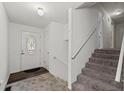 Bright entryway with a staircase and a decorative glass front door at 880 Winfield Sw Ct, Marietta, GA 30060