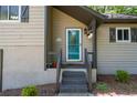 View of the house entrance, with stairs leading up to a front door with decorative glass at 880 Winfield Sw Ct, Marietta, GA 30060