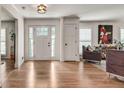 Bright foyer featuring hardwood floors, white trim, and a view into the living area at 2936 Randolph Ne Rd, Atlanta, GA 30345