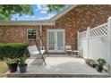 Cozy backyard patio with a swing, chairs, and potted plants at 3309 Raes Creek Rd # 13, Marietta, GA 30008