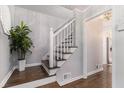Welcoming foyer with hardwood floors, a staircase, and neutral paint at 6492 Swift Creek Road, Lithonia, GA 30058