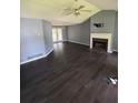 The living room features a fireplace, vinyl floors, and glass doors leading to an outdoor area at 1 Thorntree Pass, Powder Springs, GA 30127
