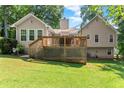 Expansive backyard featuring a large wooden deck and lush green lawn for outdoor enjoyment at 15 Miners Pt Se, Acworth, GA 30102