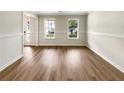 Bright dining room with plenty of natural light and updated flooring at 268 Heathrow Dr, Riverdale, GA 30274