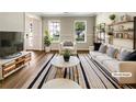 Bright living room with stylish furniture, large windows, and modern decor at 268 Heathrow Dr, Riverdale, GA 30274