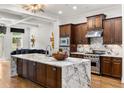 Modern kitchen with marble countertops, a stainless steel range, and custom cabinetry at 538 Sarabrook Pl, Sandy Springs, GA 30342