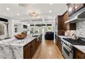 Spacious kitchen featuring hardwood floors, an island, stainless steel appliances and an open layout at 538 Sarabrook Pl, Sandy Springs, GA 30342