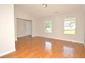 Spacious living room with hardwood floors, neutral paint, and abundant natural light at 2172 Cold Springs Cir, Lithonia, GA 30058