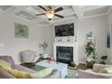 Cozy living room features a fireplace, coffered ceiling, plush seating, and ample natural light at 2820 Aralynn Way, Atlanta, GA 30337