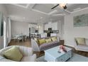 Open-concept living and dining area with hardwood floors, stylish furniture, and modern lighting at 2820 Aralynn Way, Atlanta, GA 30337