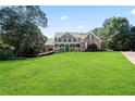 Spacious home with lush green lawn and mature trees at 4759 Highland Point Dr, Auburn, GA 30011