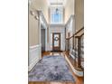 Grand foyer with hardwood flooring and staircase, leading to a bright and inviting home at 4771 Moon Chase Dr, Buford, GA 30519