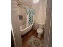 Bathroom featuring a claw foot tub with gold fixtures and a decorative shower curtain, complemented by stylish tile accents at 2500 Trent Dr, Marietta, GA 30066