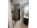 Contemporary bathroom with walk-in shower, gray marble tiling, granite countertop vanity and sleek, modern fixtures at 2500 Trent Dr, Marietta, GA 30066