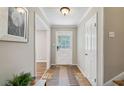 Inviting home entrance featuring a tiled floor, neutral walls, and a charming front door at 5510 Stoneybrook Se Ct, Mableton, GA 30126