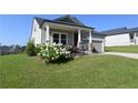 A cozy home featuring pretty landscaping, neat lawn and neutral colors at 1057 Towne Mill Xing, Canton, GA 30114