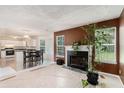 Inviting living room featuring a fireplace and seamless flow into the adjacent dining area and kitchen at 2601 Brandenberry Dr, Decatur, GA 30034