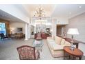 Welcoming lobby area featuring elegant chandelier and a comfortable seating area at 300 Peachtree Ne St # 11C, Atlanta, GA 30308