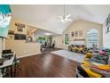 Bright living room with vaulted ceilings, hardwood floors, and a fireplace at 876 Ashton Oak Cir, Stone Mountain, GA 30083