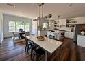 Spacious modern kitchen featuring stainless steel appliances, a center island, and ample counter space at 2873 Shoals Hill Ct, Dacula, GA 30019