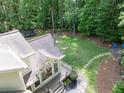 Aerial backyard view with a trampoline, fire pit, chairs, a soccer net, and access to the deck at 4673 Jefferson Township Pl, Marietta, GA 30066