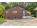 The exterior features a combination of brick and wood with expansive yard at 4847 Lakewood Dr, Acworth, GA 30101