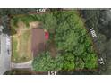 Aerial view showing the property lines, house, yard, and surrounding greenery at 6372 Valley Dale Dr, Riverdale, GA 30274