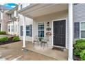 Inviting home entrance with chairs and a welcome sign at 261 Venture Path, Hiram, GA 30141