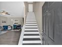 Inviting home entryway featuring stairs and grey luxury vinyl plank flooring at 261 Venture Path, Hiram, GA 30141