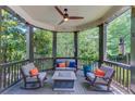 Cozy porch seating area with a fire pit, creating a perfect space for outdoor entertainment at 260 W Peachtree St, Norcross, GA 30071