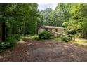 Exterior view of the property showcasing the facade and surrounding landscape at 400 Mccart Rd, Mcdonough, GA 30252