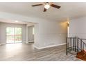Bright living room boasts hardwood floors and a sliding glass door to the outdoor patio at 4133 Conley Circle Cir, Conley, GA 30288