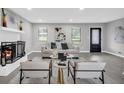 Stylish living room featuring a fireplace and contemporary decor with neutral tones at 6607 Forestdale Ln, Douglasville, GA 30135