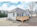 A well-maintained backyard features a new wooden deck on a gray sided house at 6005 Crowley Dr, Douglasville, GA 30135