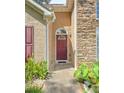 Close up of the home's front door and stone accents by the entryway at 625 Chaseridge Dr, Mcdonough, GA 30253