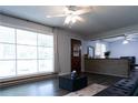 Open-concept living space with large windows and stylish flooring, leading to the entryway at 1112 Mealor Rd, Lawrenceville, GA 30043
