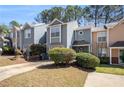 Beautiful townhome with a well manicured lawn and driveway at 1221 Overton Dr, Lawrenceville, GA 30044