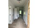 Bright hallway featuring modern flooring, wainscoting, and a convenient mudroom area at 1522 Reserve Glen Dr, Lawrenceville, GA 30043