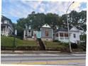 Charming neighborhood street featuring historic homes, lush greenery, and classic architecture needing repairs at 255 Georgia Se Ave, Atlanta, GA 30312