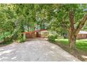 Attractive single-story home with a carport, brick accents, and lush landscaping at 2991 Monterey Drive Dr, Decatur, GA 30032