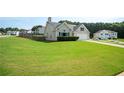 Spacious front yard and well-maintained landscaping enhance the curb appeal of this suburban home at 4776 Harrod Ct, Douglasville, GA 30135
