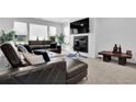 Comfortable living room featuring a fireplace and a sectional sofa at 611 Sugar Prairie Bnd, Lawrenceville, GA 30045