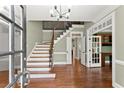 Inviting foyer with hardwood floors, staircase, and open doorway at 15 Vickwood Court Ne, Marietta, GA 30068