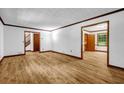 Open living room with hardwood floors, neutral walls, and easy access to other areas of the house at 2775 Doaks Run Ct, Tucker, GA 30084
