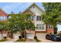 Beautiful townhome with an attached garage, lovely brick facade, and well-maintained landscaping at 1403 Ashford Creek Ne Cir, Atlanta, GA 30319