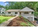Inviting single-story home with a front porch and an attached garage at 4103 Statewood Ne Rd, Atlanta, GA 30342