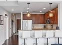 Open-concept kitchen with granite countertops, stainless steel appliances, and seating at the breakfast bar at 855 Peachtree Ne St # 3005, Atlanta, GA 30308