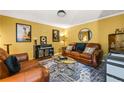 Cozy living room featuring leather sofas, stylish decor, and a comfortable atmosphere at 5130 Stoneywood Se Cir, Mableton, GA 30126