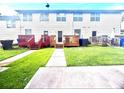 Backyard with grass and a small wood deck at 134 Odyssey Turn, Conyers, GA 30012